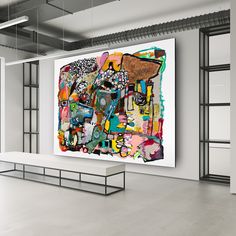 an abstract painting hangs on the wall next to a bench in a room with open shelving