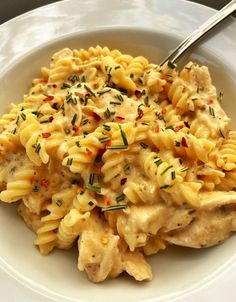 a white bowl filled with macaroni and cheese