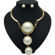 Description Here is a stylish Gold Pearl Necklace which not only modifies your look but also adds value to your personality. The Pearl has a soft glamour which makes it look very beautiful. There are two colors on this necklace available which are Gold and Silver. One can wear these necklaces for any occasion or ceremony. Features Material:Metal, Copper Alloy Pattern:Geometric Color:Gold /silver Pendant material:Pearl What Includes 1*Necklace 1 Pair ofEarrings Measurement Earrings Height: 0.90 i Elegant White Alloy Jewelry, Elegant Alloy Necklaces For Party, Elegant Party Necklaces In Alloy, Elegant Metal Pearl Necklace For Party, Chic White Pearl Jewelry, Chic White Choker Jewelry, Elegant Metal Dangle Bib Necklaces, Pearl White Dangle Jewelry For Party, Elegant Party Jewelry Sets With Choker