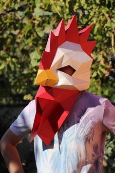 a person wearing a paper chicken mask