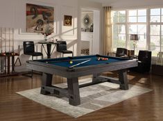 a pool table in the middle of a living room