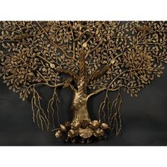 a metal tree sculpture on a black background