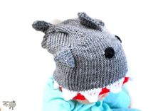 A hand knitted shark hat with TEETH! An adorable hand-crafted animal hat. This hat is just right for a baby gift. Would be a great addition to your newborn's photo shoot. Having an animal themed party? This hat would give your child's costume the final touch! Need a prop for your gender reveal party? Each hat is handmade with love.  Hat fits these sizes: preemie 0-3 months 3-6 months 6-9 months 9-12 months 1-3 years 4-12 years 13+ years If you have any questions, please contact me. Hats are made Baby Shark Hat, Shark Beanie Crochet, Knit Shark Hat Pattern, Baby Shark Knitted Hat, Beanie Hat Custom Sea, Shark Hat, Sister Crafts, Photoshoot Props, Animal Hats