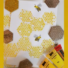 bees and honeycombs cut out on paper with glue