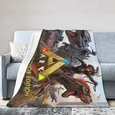 a throw blanket that has an image of godzillas and tri - ray on it