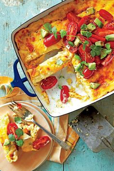 a casserole dish with tomatoes and other vegetables