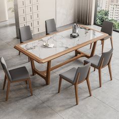 a dining room table with chairs around it