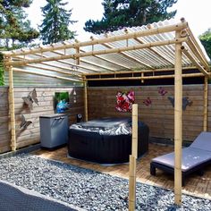 an outdoor hot tub in the middle of a garden