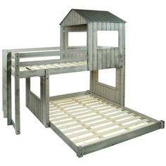 a wooden bunk bed with a small house on top