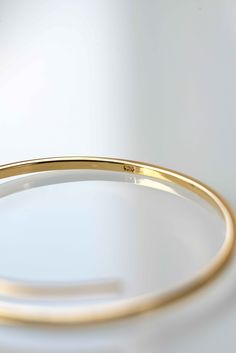 **GOLD BANGLE WILL BE RESTOCKED BY JUNE23, please add yourself to the waiting list and you'll receive an automated email notification as soon as it is restocked. Modern and minimal yet classic and elegant. Our Crossover Bangle is an investment piece and will always have a place in your collection of jewelry. The bangle comes in one size 2.6 inches diameter and can be adjusted to the size of your wrist. Handmade with utmost care with the finest sterling silver and plated with the highest quality Minimalist Polished Bangle For Formal Occasions, Minimalist Round Cuff Bracelet With Polished Finish, Minimalist Cuff Bracelet With Polished Finish, Classic Hoop Cuff Bracelet Gift, Classic Hoop Cuff Bracelet As Gift, Minimalist Yellow Gold Cuff Bracelet For Formal Occasions, Minimalist Gold Bracelets With Polished Finish, Minimalist Gold Hoop Bracelet, Adjustable Minimalist Gold Bracelet With Polished Finish