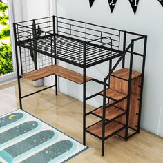 a metal loft bed with stairs and desk underneath it in a living room next to a potted plant