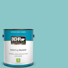 the behr ultra paint and primer in one is shown on a green background