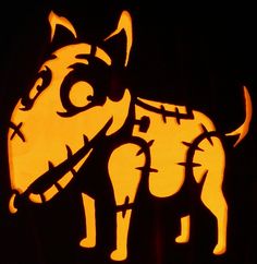 a carved pumpkin with an image of a dog on it