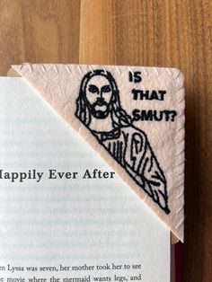 Introducing our new Embroidered Corner Bookmark, featuring the whimsical "Is that Smut?" and " I saw That" design!  This unique and humorous bookmark adds a touch of playfulness to your reading experience. The intricately embroidered corner showcases a playful depiction of Jesus peeking mischievously, bringing a smile to your face every time you open your book. Crafted with precision and care, this bookmark is made from high-quality materials to ensure durability and longevity. The intricate sti Corner Page Bookmarks, Book Assesories, Diy Bookmark Gift, Diy Book Lover Gifts, Felt Bookmarks Diy, Crafts For Book Lovers, Cute Homemade Gifts For Friends, Hand Sewn Gifts, Thoughtful Homemade Gifts