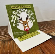 a christmas card with a deer on it