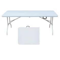 a white rectangular table with two legs and a bag on the ground next to it