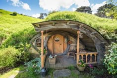 the hobbot house is made out of wood and grass