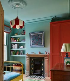 a bedroom with blue walls and a fireplace