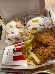 a chicken sandwich and french fries in a box