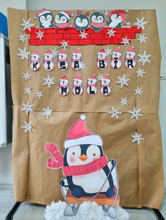 a bulletin board with penguins and snowflakes on it