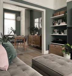 a living room filled with furniture and a flat screen tv sitting on top of a wooden table