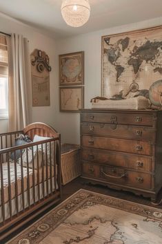 a baby's room with a crib, dresser and map on the wall