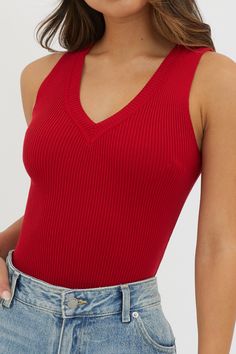 Solid Ribbed V-neck Knit Top, Stretch V-neck Top With Ribbed Neckline, Trendy V-neck Top With Ribbed Neckline, Stretch Ribbed V-neck Tank Top, Spring Ribbed V-neck Knit Top, Stretch Seamless V-neck Knit Top, Red Knit V-neck Top, Red Seamless V-neck Top, Fitted Solid V-neck Knit Top