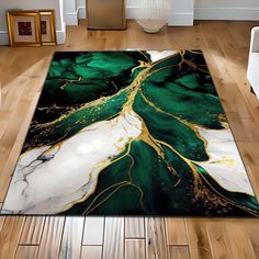 a green and white area rug with gold lines on the floor in a living room