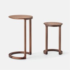 two wooden tables sitting next to each other