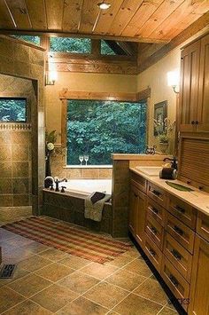 a bathroom with a tub, sink, and window in the middle of it's walls