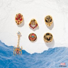 When it comes to Marvel's most iconic Super Heroes, there's no one quite like the crime-fighting teenager Peter Parker. Our Marvel’s Spider-Man Studs features Peter Parker's iconic Spider-Man mask, radiating an astonishing shade of red and encased within a web of intricate metal work. The set also includes an elegant hanging red spider, adding a touch of allure to any outfit. With great power comes great responsibility, and these accessories are sure to make an amazing statement. Gifts For Marvel Fans, Spider Man Mask, Web Shooters, Marvel Jewelry, Web Slinger, Spider Man Miles, Spider Man Miles Morales, Jewelry Wishlist, Red Spider