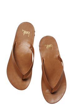 Lounge by the poolside in luxe style with this smooth leather flip-flop boasting arch support and a grippy rubber sole for steady strides. Arch support Leather upper and lining/rubber sole Made in Brazil Tan Flip Flops, Beach Flip Flops With Leather Footbed, Brown Cushioned Flip Flops For Surfing, Brown Flip Flops With Arch Support For Summer, Leather Footbed Toe Loop Flip Flops For Beach, Leather Round Toe Flip Flops For Beach, Classic Leather Footbed Flip Flops For Vacation, Toe Loop Flip Flops With Leather Footbed For Beach, Leather Flip Flops With Arch Support For Beach