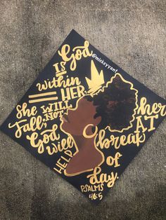 a black and gold graduation cap with the words, if god was within her, she will not be loved at all