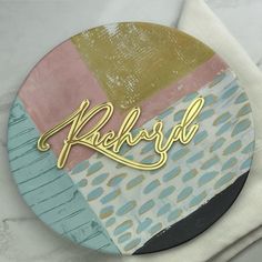 a close up of a plate with the word krehrd on it and some napkins