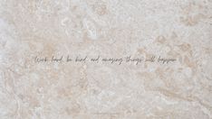 the words are written in cursive writing on marble