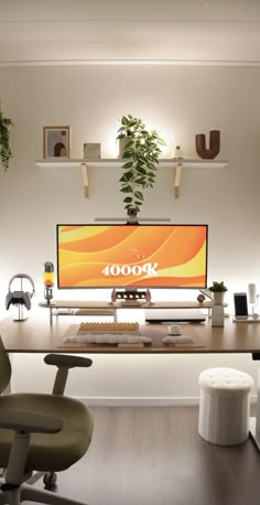 an office desk with a computer monitor and chair in front of it, surrounded by potted plants