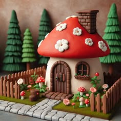 a mushroom house with flowers and trees in the background on a miniature garden set up