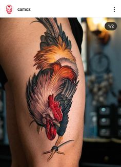 a rooster tattoo on the back of a woman's thigh