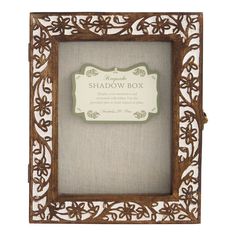 a shadow box with an ornate wooden frame