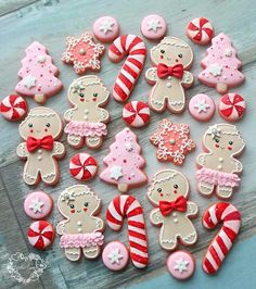 decorated cookies are arranged on a wooden table