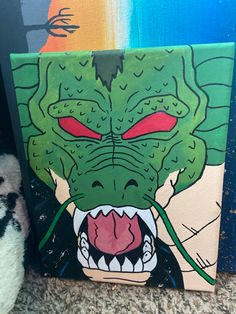 a painting of a green monster with red eyes and fangs on it's face