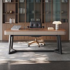 an office desk in front of a bookcase