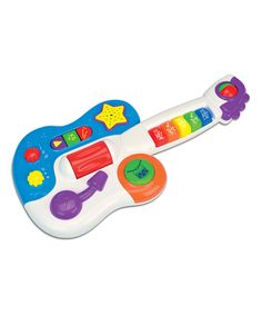 a toy guitar with musical instruments on it