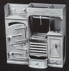 an old fashioned stove and oven is shown in this black and white photo with the door open