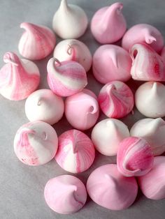 some pink and white candies on a table