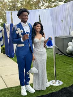 Hoco Black Couple, White And Silver Prom Dress Couple, Blue And Gold Prom Couple, Royal Blue Prom Outfits For Couples, Silver Prom Dress Couple, Black And Blue Prom Couple, Silver Prom Couple, Prom Colors For Couples Black, Black Prom Couples Outfit