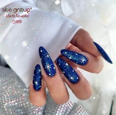 Take your manicure to another dimension with 30 breathtaking galaxy nail designs. These nail inspirations capture the cosmic beauty of galaxies, offering a chic and stylish way to elevate your manicure game with a touch of the universe. Blue Nail Designs Winter, Blue And White Nails Christmas, Blue New Years Nails, New Years Nails Blue, Stars Nails Design, Blue Nails With Stars, Nails Blue Winter, Dark Blue Christmas Nails, Black Blue Nails