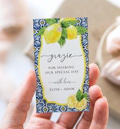 a person holding up a business card with lemons on it that reads, organic for sharing our special day with love elyse adam