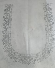 a piece of paper with an embroidered border on it