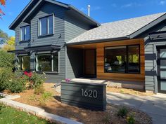 a house that has a mailbox in front of it and the number 1260